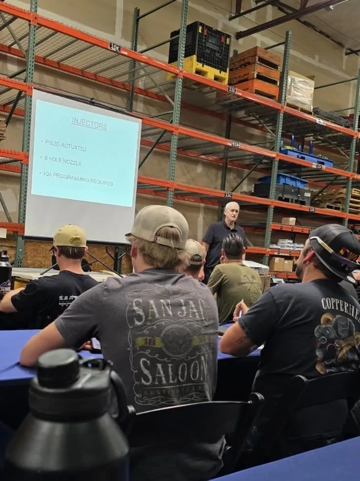 3A Automotive team participating in specialized Ford Powerstroke educational workshop in May 2024