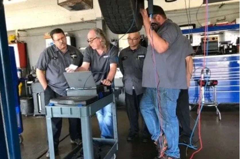 Automotive technicians in professional training classroom session