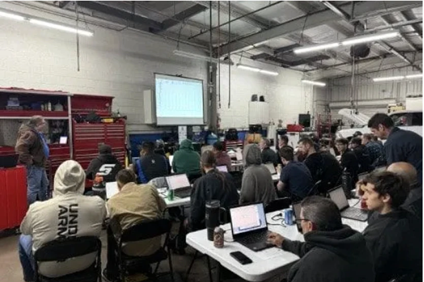 Hands-on automotive workshop training session with instructors