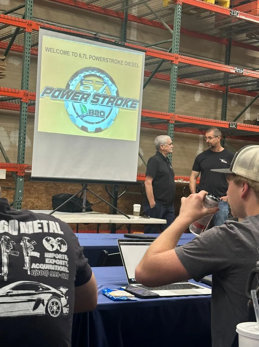Hands-on Ford diesel engine repair training session with professional automotive technicians