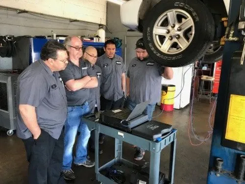 Professional automotive education workshop featuring cutting-edge diagnostic equipment and techniques