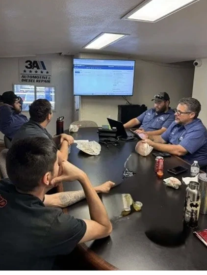 Automotive technician engaged in professional development training
