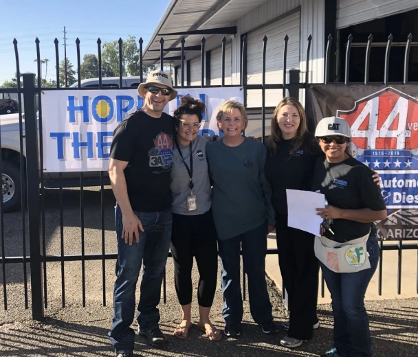 Final photo from the 2018 Turbo Boost Car Giveaway event celebrating the donation of a vehicle to a Sunnyslope Elementary School teacher by 3A Automotive