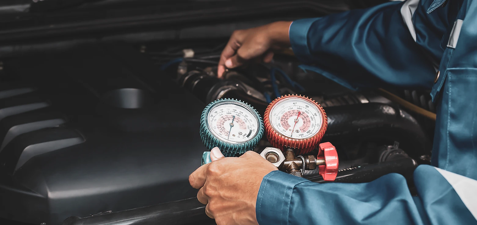 Professional mechanic performing oil change service