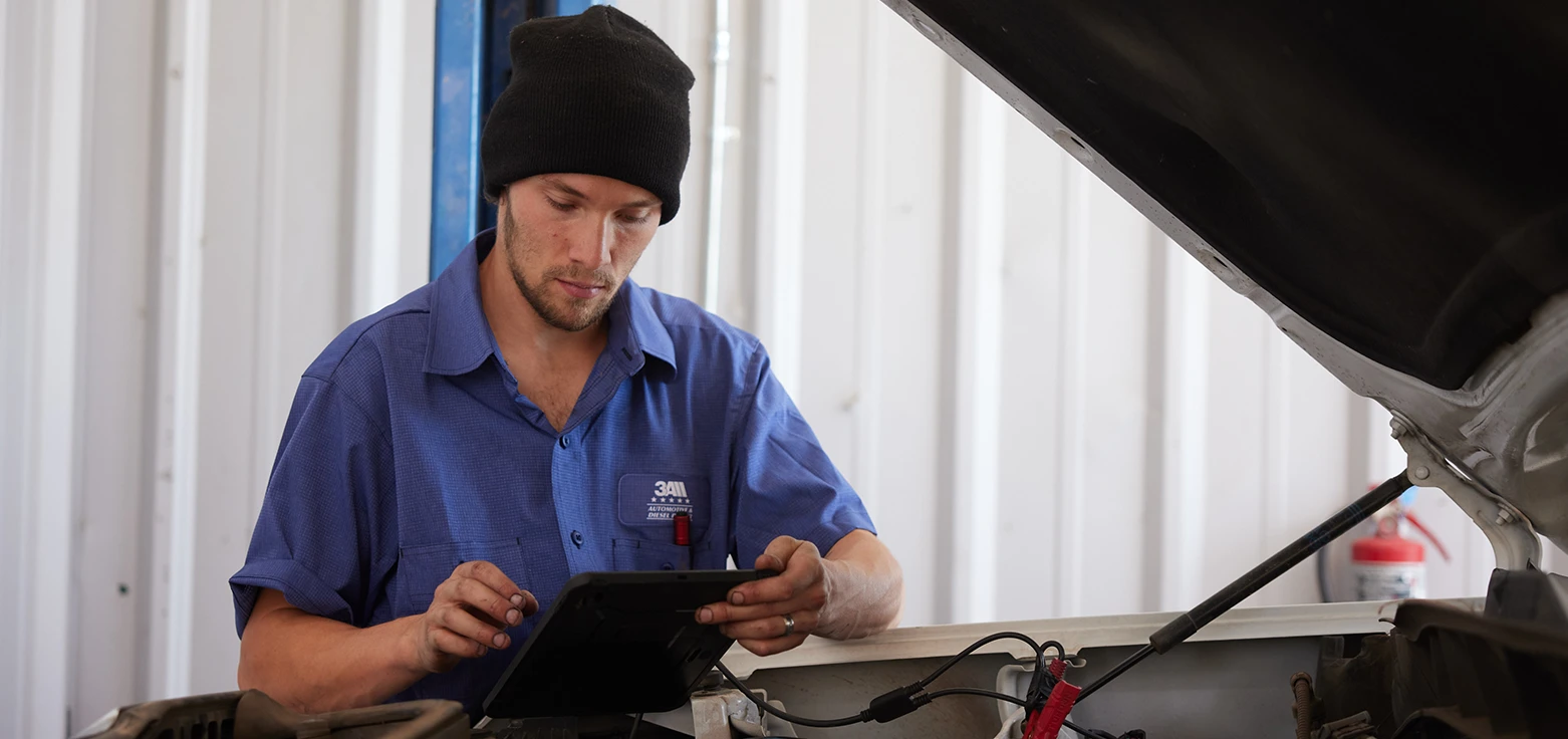 Professional mechanic performing oil change service