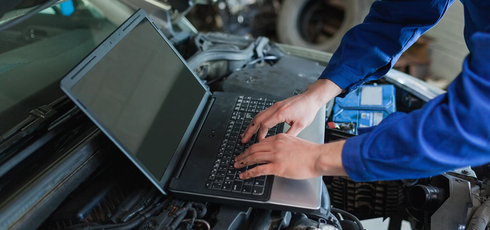 Professional mechanic performing oil change service